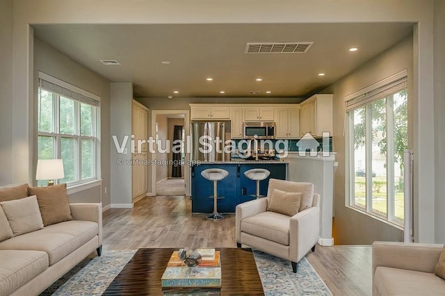 living room with light hardwood / wood-style floors