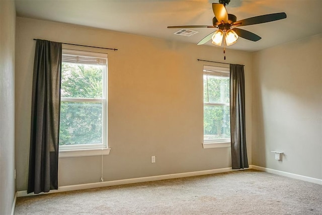 carpeted empty room with ceiling fan