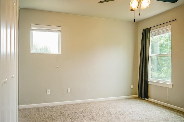 carpeted empty room with ceiling fan