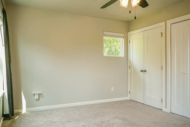 unfurnished bedroom with light carpet and ceiling fan