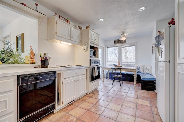 kitchen with white cabinetry, ceiling fan, black appliances, and a textured ceiling