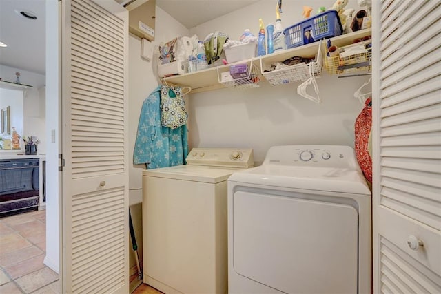 clothes washing area with washer and dryer