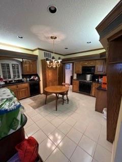 kitchen with light tile patterned flooring, decorative light fixtures, ornamental molding, stove, and a notable chandelier