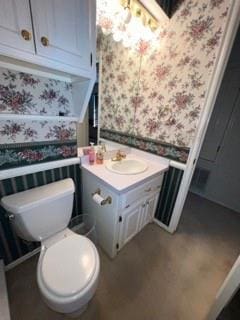 bathroom with vanity and toilet