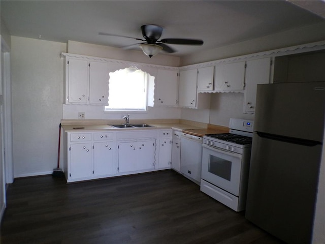 kitchen featuring sink, white appliances, ceiling fan, dark hardwood / wood-style floors, and white cabinets