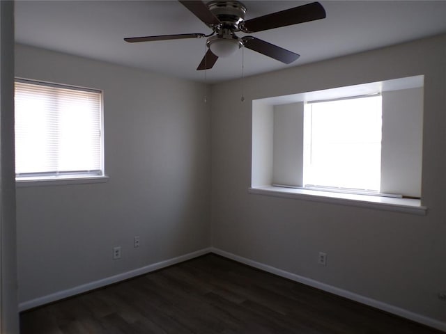 spare room featuring dark hardwood / wood-style floors