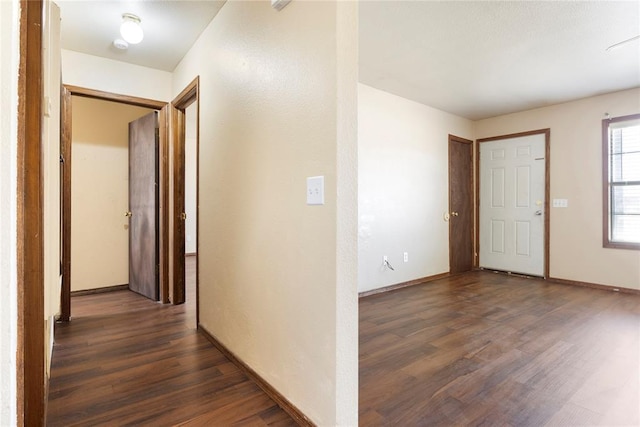 hall with dark wood-type flooring