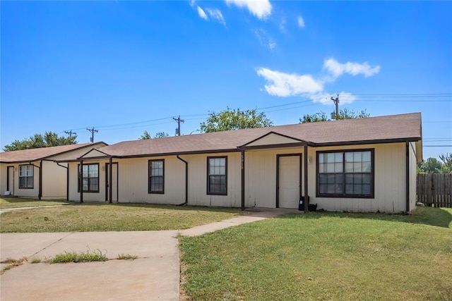 ranch-style home featuring a front yard