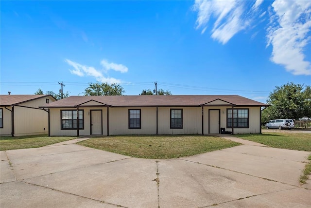 ranch-style home with a front lawn