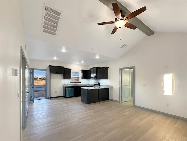 kitchen with appliances with stainless steel finishes, beamed ceiling, wood-type flooring, a center island, and ceiling fan