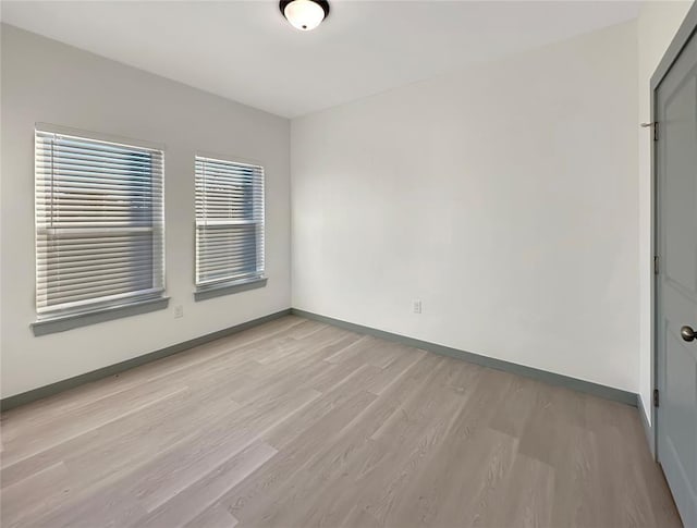 unfurnished room featuring light wood-type flooring