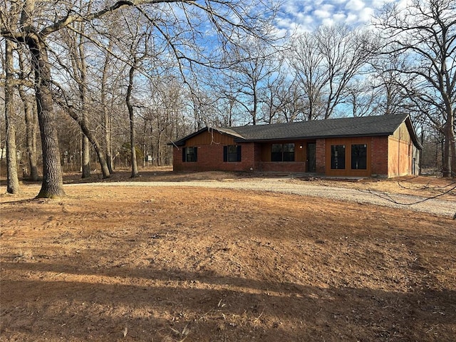 view of front of home with brick siding