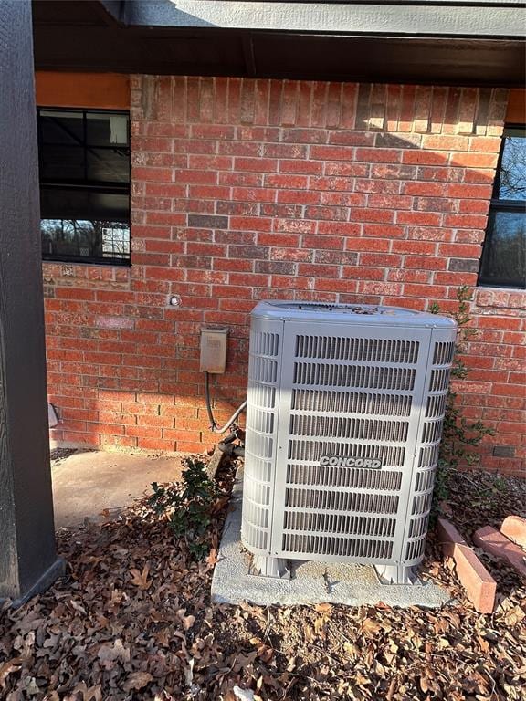 details with central AC and brick siding