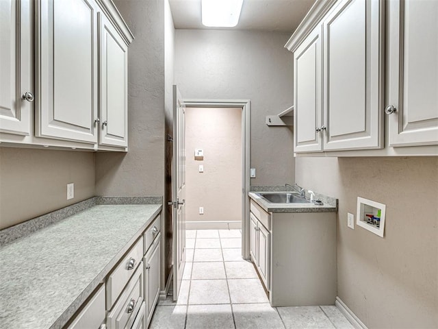 kitchen featuring sink and light tile patterned floors