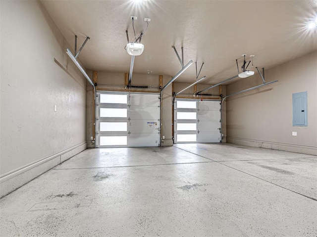 garage featuring a garage door opener and electric panel