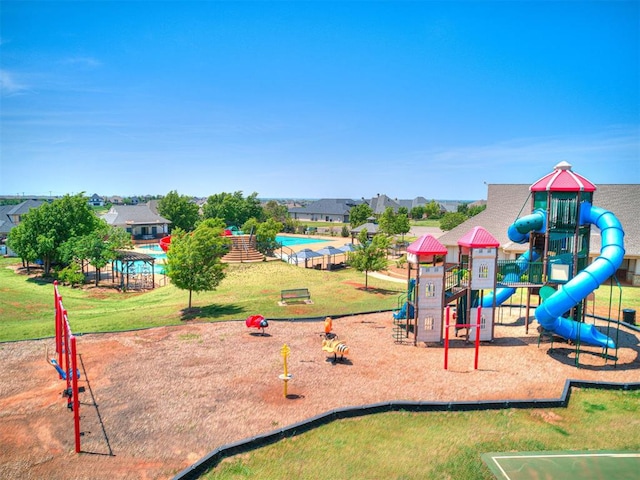 view of playground with a lawn