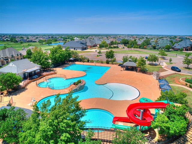 view of pool with a water slide