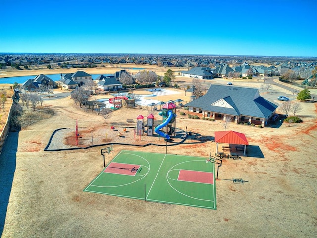 view of basketball court featuring a playground and a gazebo