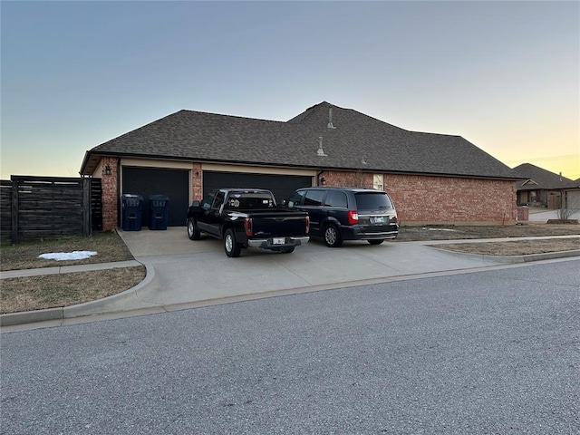 property exterior at dusk with a garage