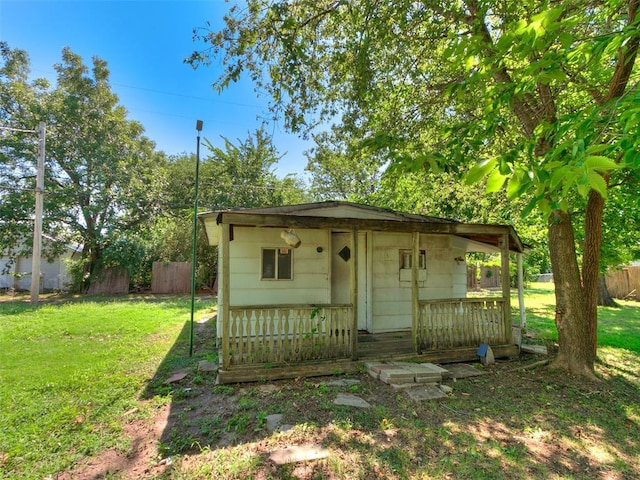 view of outbuilding with a yard