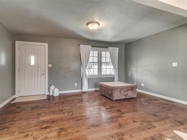 foyer entrance featuring hardwood / wood-style floors