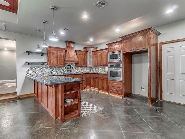 kitchen with appliances with stainless steel finishes, tasteful backsplash, custom exhaust hood, hanging light fixtures, and kitchen peninsula