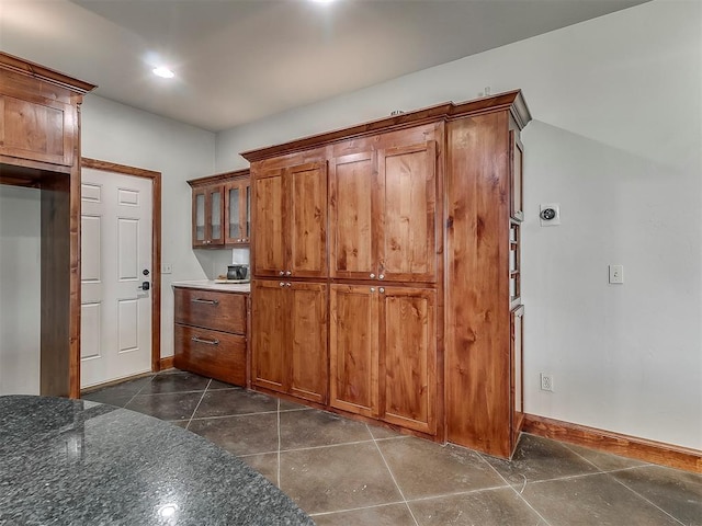 kitchen with dark stone countertops