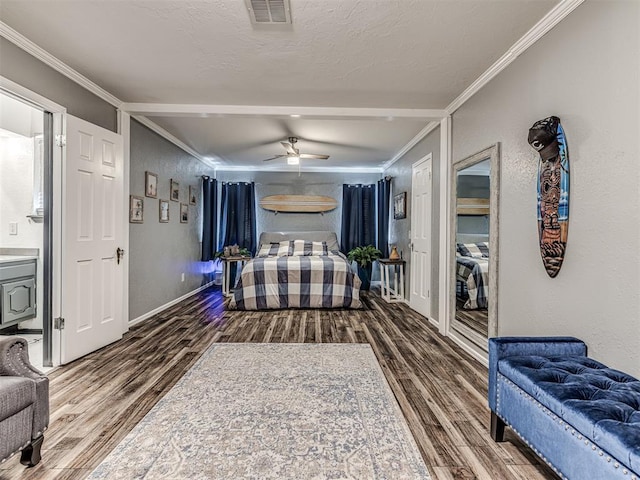 bedroom with hardwood / wood-style floors, ornamental molding, a textured ceiling, and ceiling fan