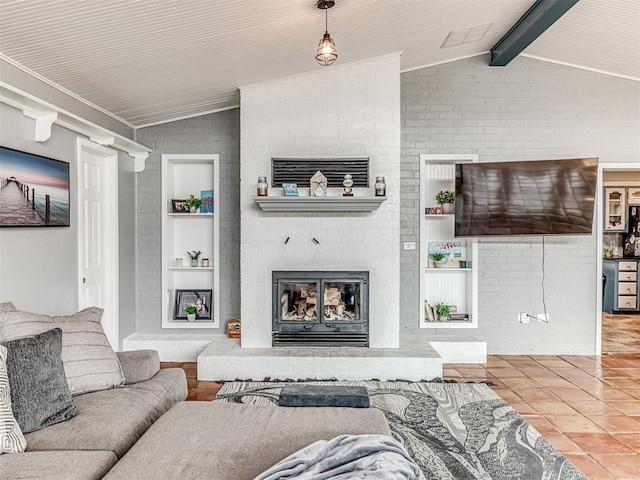 tiled living room with built in shelves, brick wall, a fireplace, and lofted ceiling with beams