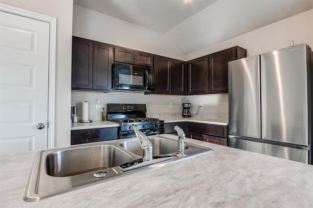 kitchen featuring lofted ceiling, sink, black appliances, and dark brown cabinetry