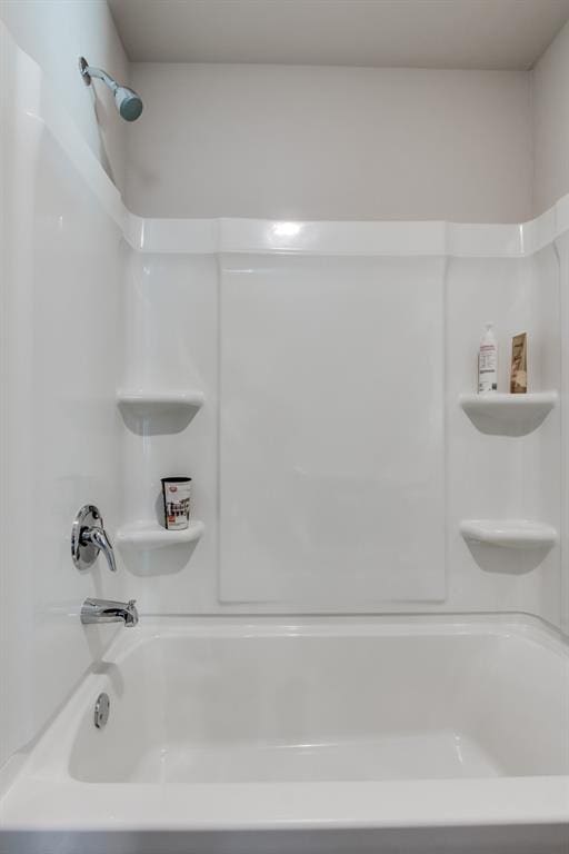 bathroom with shower / bathtub combination