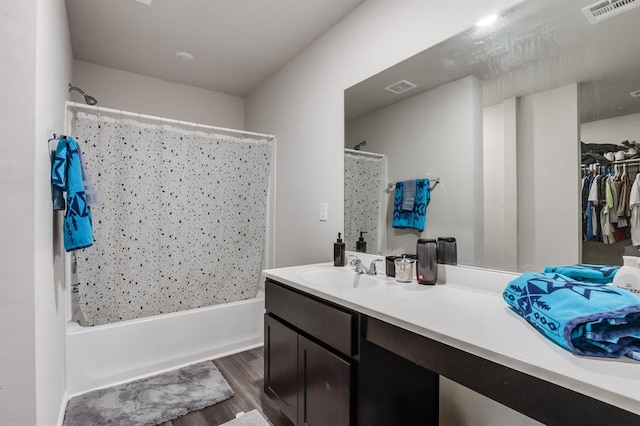 bathroom featuring shower / bath combo, wood-type flooring, and vanity