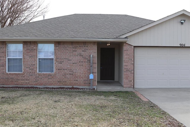 single story home featuring a garage and a front yard