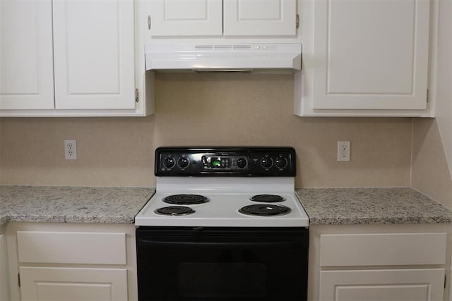 kitchen with range with electric cooktop, light stone counters, and white cabinets