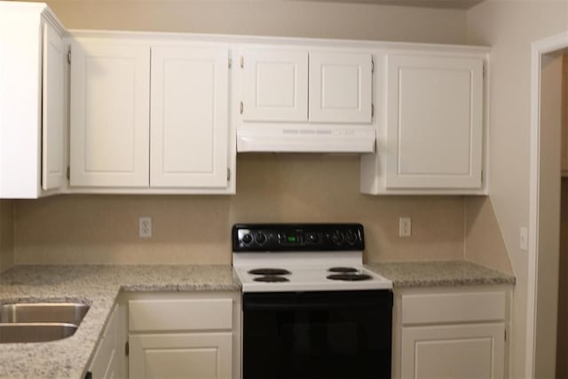 kitchen featuring white cabinetry, light stone countertops, sink, and electric range