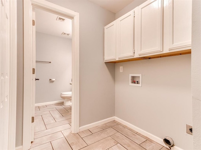 washroom featuring visible vents, hookup for a washing machine, hookup for an electric dryer, and cabinet space