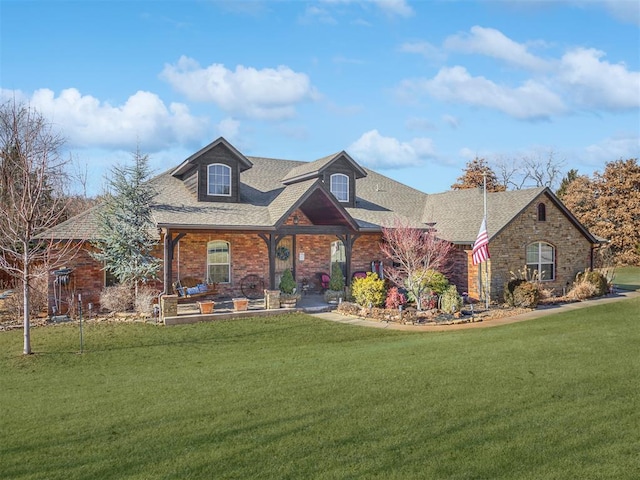 view of front of house featuring a front yard and a patio