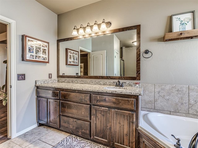 bathroom featuring vanity, a bathing tub, and tile patterned flooring