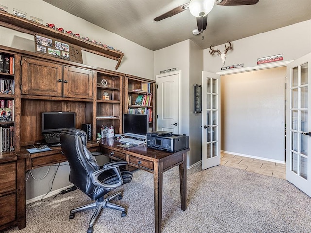 carpeted home office with french doors and ceiling fan