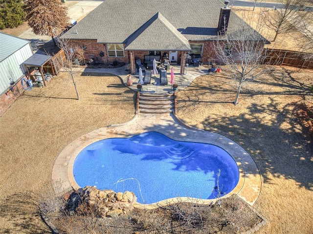 view of pool featuring a patio