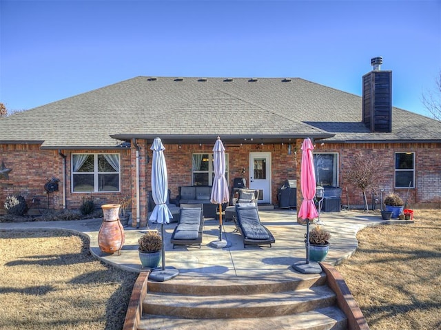 rear view of property with a patio