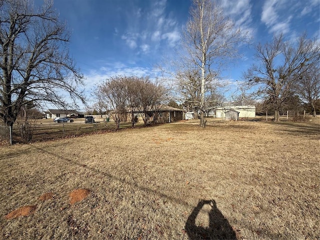 view of yard with a rural view