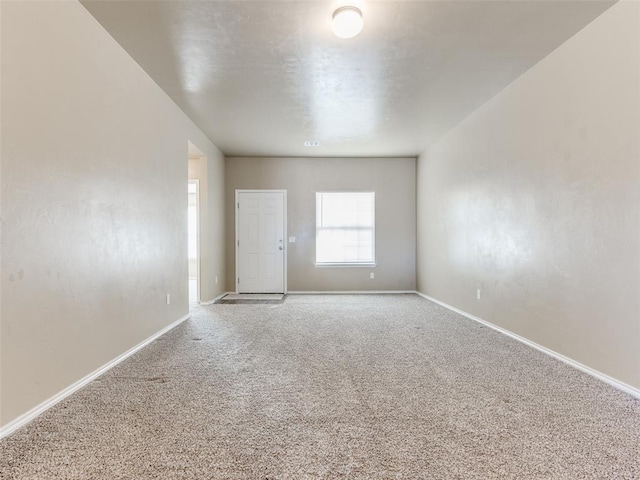 unfurnished room featuring carpet flooring