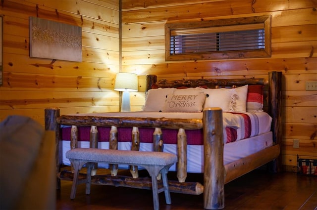 bedroom featuring wood-type flooring and wood walls