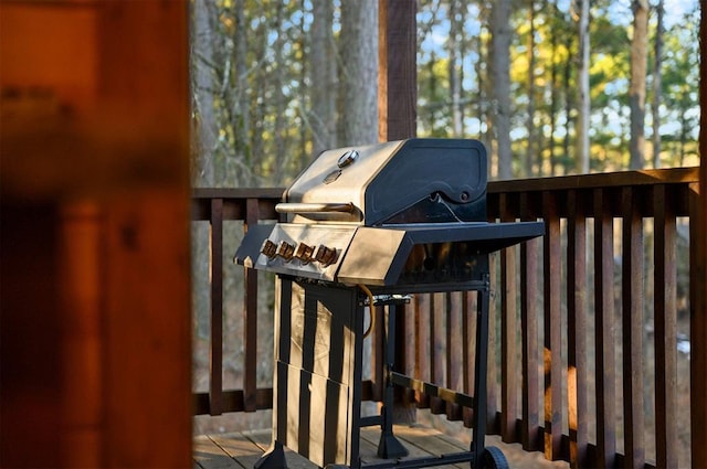 wooden deck featuring area for grilling