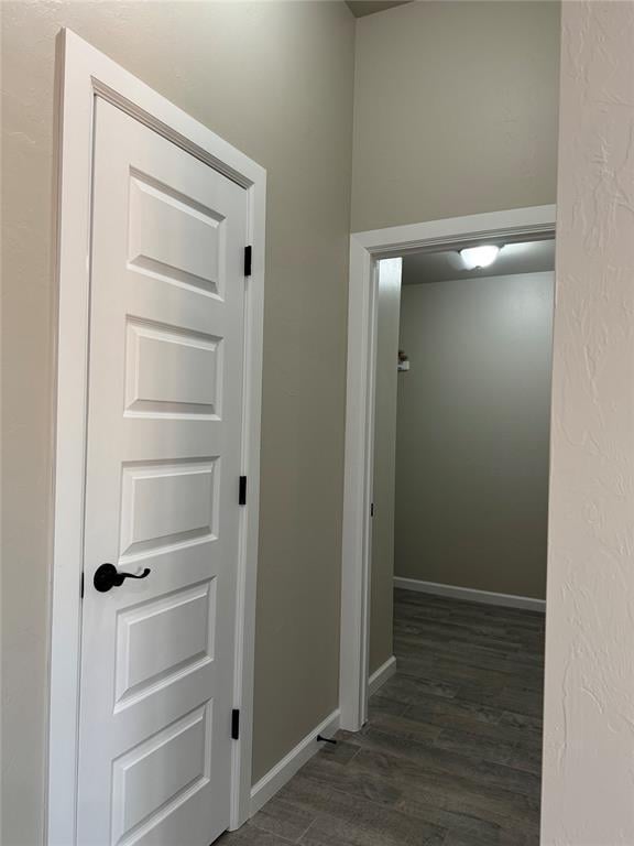 hallway featuring dark hardwood / wood-style floors