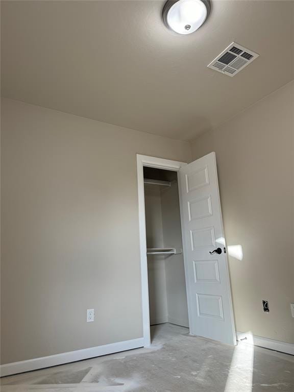 unfurnished bedroom with a closet