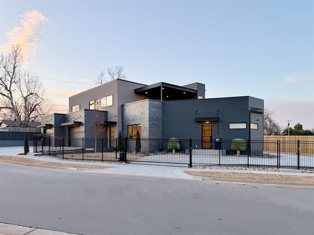 view of outdoor building at dusk