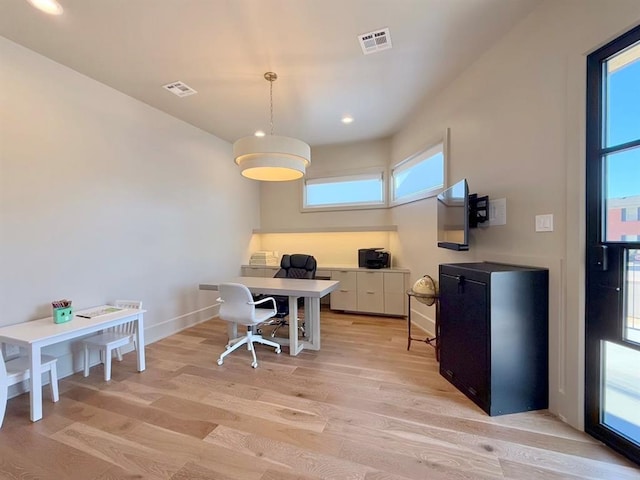 office area with light hardwood / wood-style flooring