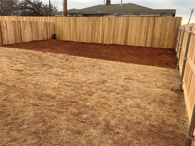 view of yard featuring a fenced backyard